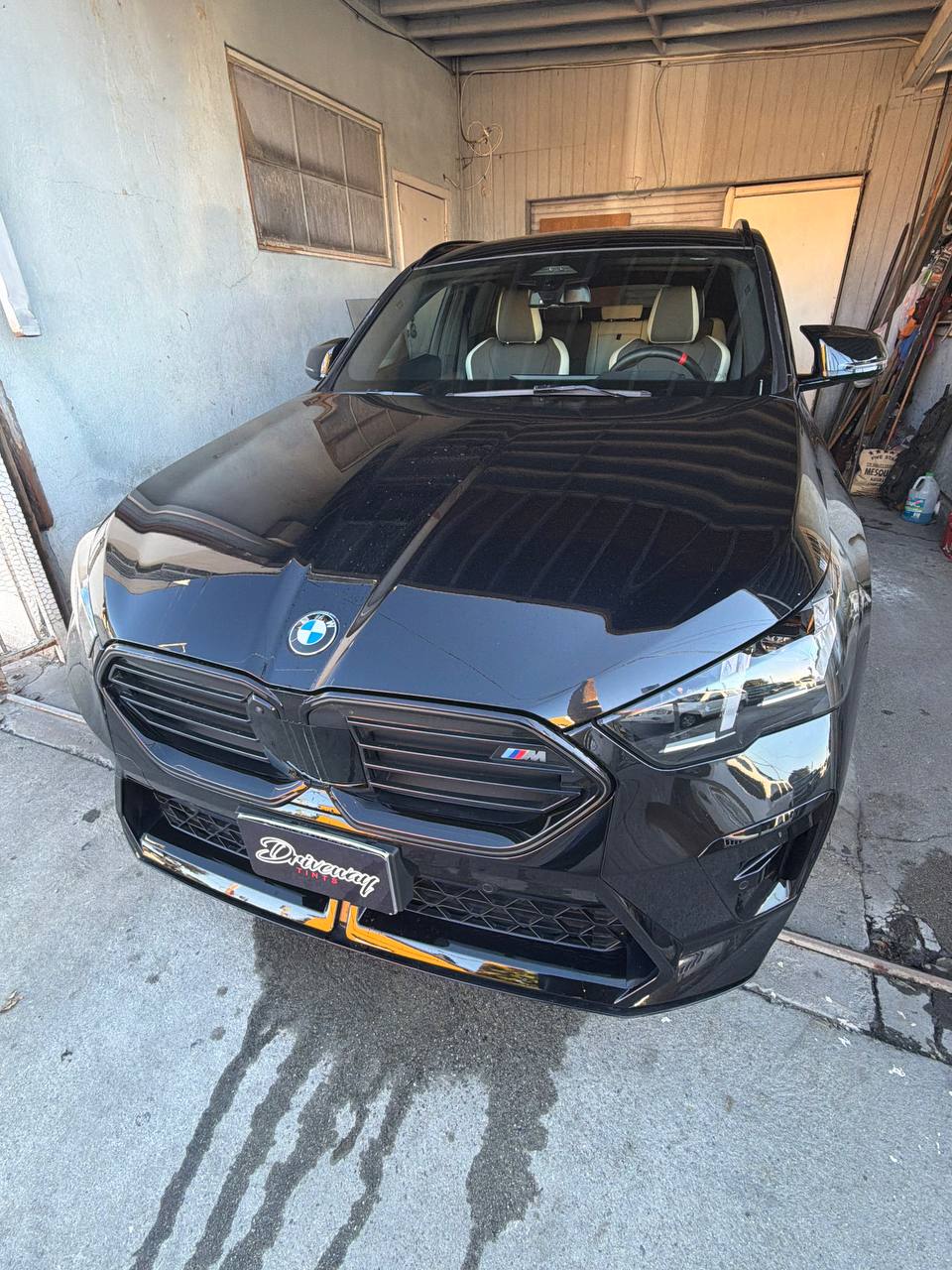 Black BMW M — before tint, front view